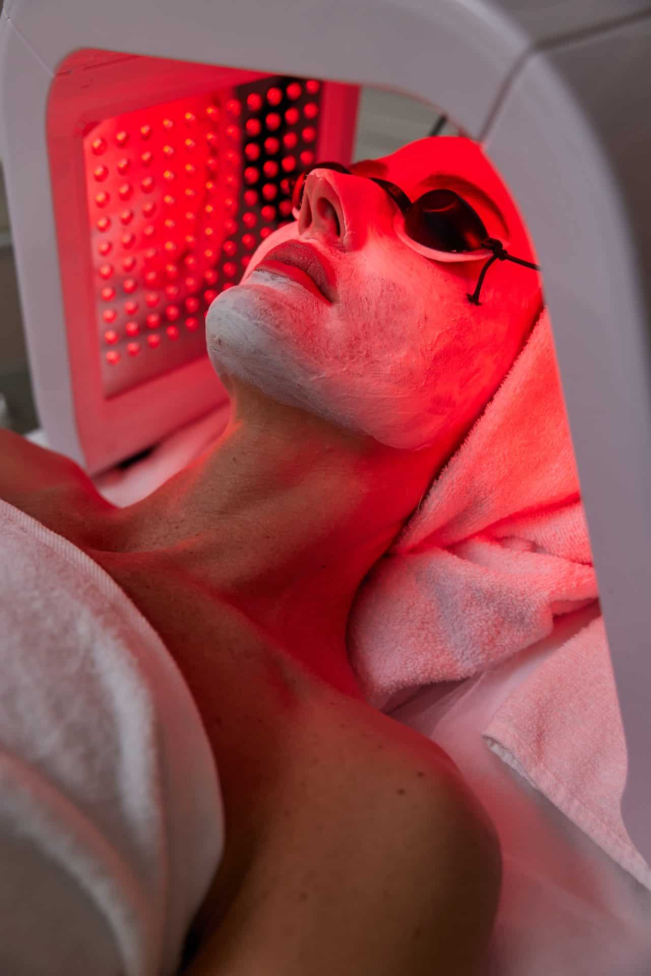 Woman getting facial treatment with led therapy 2024 10 22 03 06 18 utc